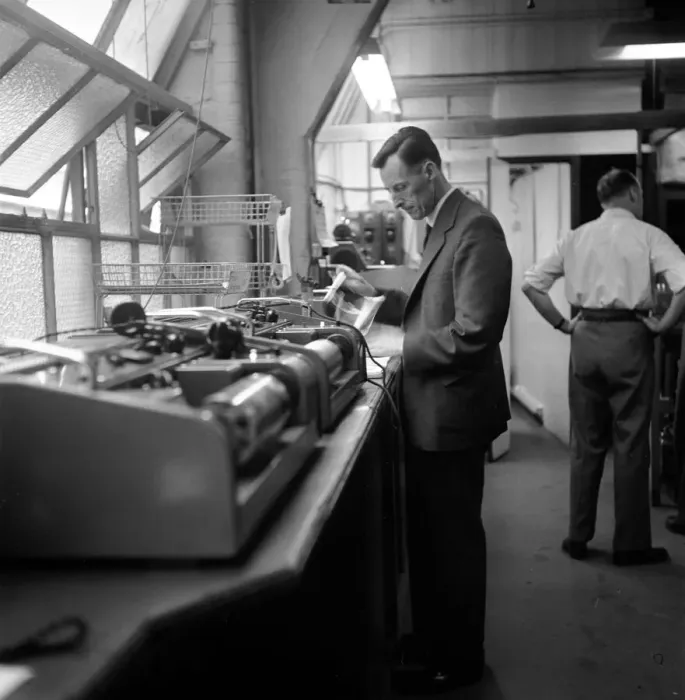 Framed Print : Bernard Coster, Daily Mirror Telephoto Room technician, seen here at work Framed Print : Bernard Coster, Daily Mirror Telephoto Room technician, seen here at work