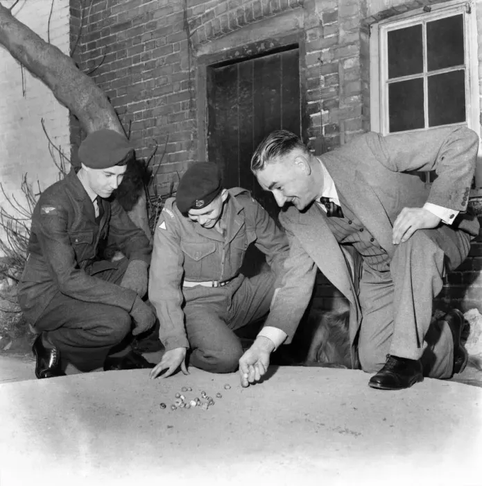 Framed Print : Bernard Wilcock Seen here playing marbles with a group of soldiers. March 1953 D1555 Framed Print : Bernard Wilcock Seen here playing marbles with a group of soldiers. March 1953 D1555
