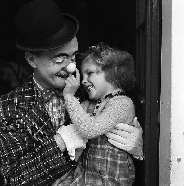 Bertram Mills Circus Clown Alby Austin visiting blind children. 15th December 1951