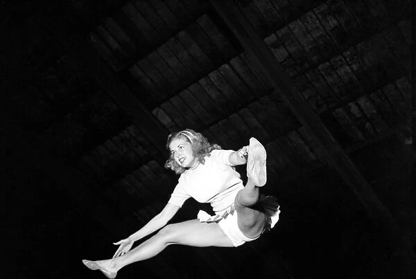 Beverley Ferris acrobat performing with the Globe Trotters Basketball team