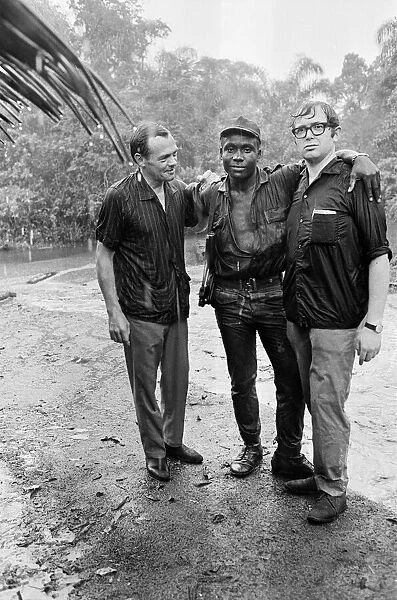 A Biafran soldier seen here with Daily Herald staff photographer Ron Burton (left