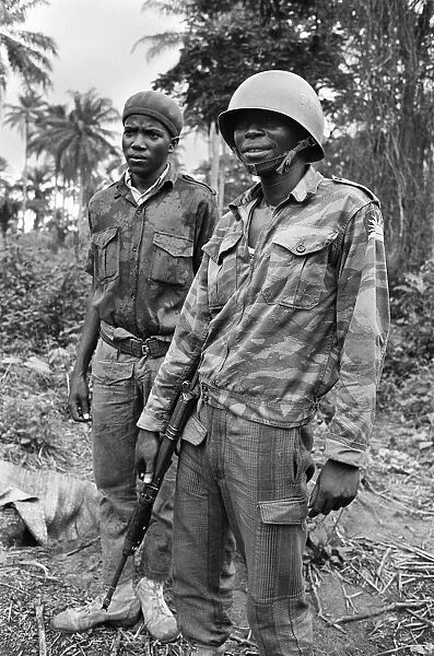 A Biafran soldier seen here in relaxed mood, armed with an AK47 semi automatic rifle