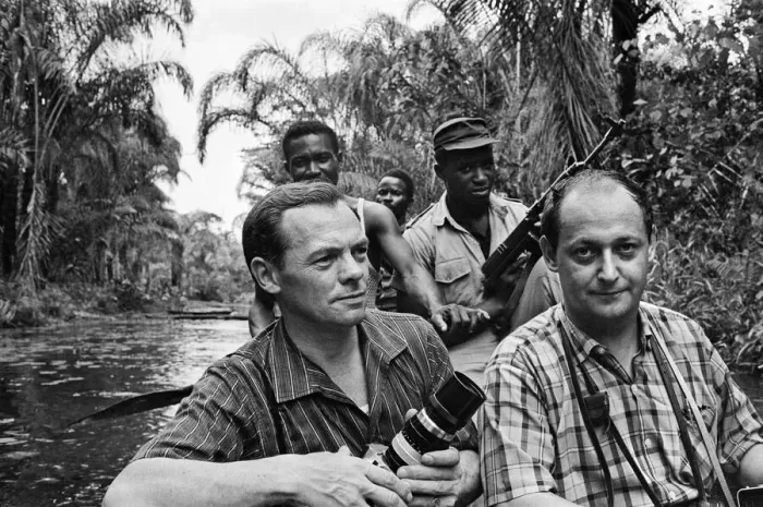 Framed Print : Biafran soldiers seen here crossing the river ina canoe with Daily Herald staff Framed Print : Biafran soldiers seen here crossing the river ina canoe with Daily Herald staff