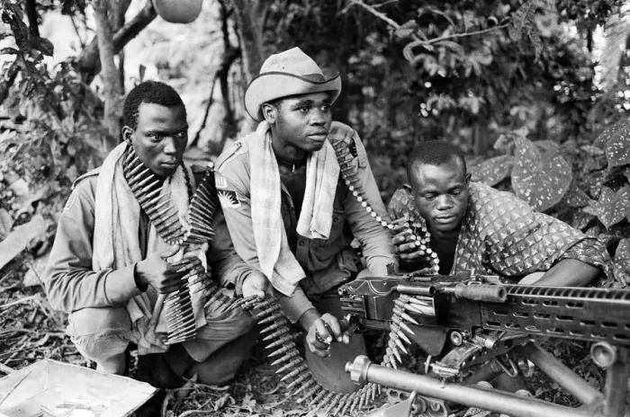 Framed Print : Three Biafran soldiers seen here operating a heavy machine gun during the Biafran conlict Framed Print : Three Biafran soldiers seen here operating a heavy machine gun during the Biafran conlict