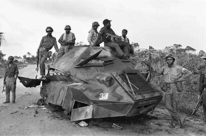 Framed Print : A Biafran soldiers seen here sitting on a destroyed Nigerian army armoured personnel Framed Print : A Biafran soldiers seen here sitting on a destroyed Nigerian army armoured personnel