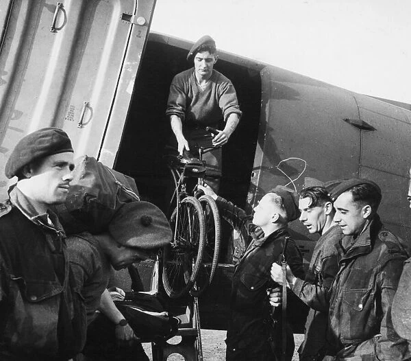 Bicycles being unloaded from an aircraft on the captured aerodrome at Maison Blanche