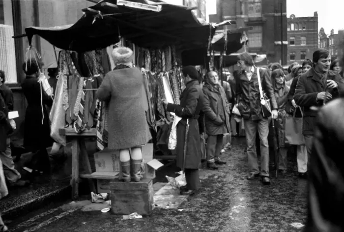 Framed Print : Last of the big spenders at Petticoat Lane. This lady stall holder uses a box to keep up