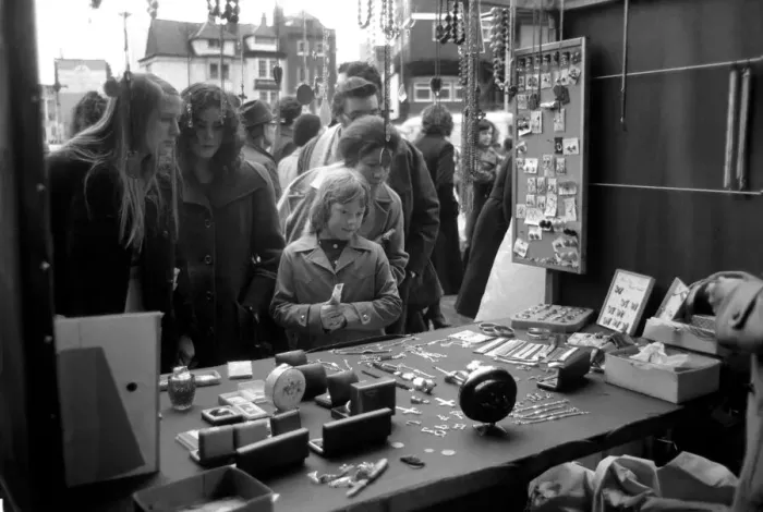 Framed Print : Last of the big spenders at Petticoat Lane. The moment of decision for 8-year-old Deborah