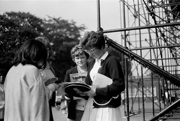 Billie Jean King signs autographs for admirers at the Northern Lawn Tennis Tournament