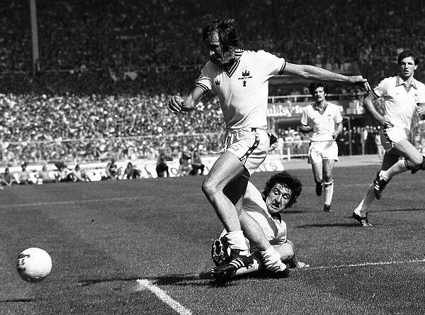 Billy Bonds is tackled by Brian Talbut of Arsenal during the FA Cup Final 1980