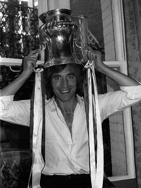 Billy Bonds the West Ham Captain with the FA Cup on his head at the Town Hall reception