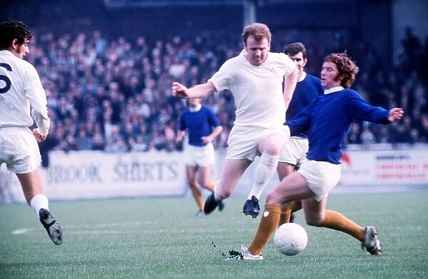 Billy Bremner of Leeds and Alan Ball of Everton battle for the ball during their match