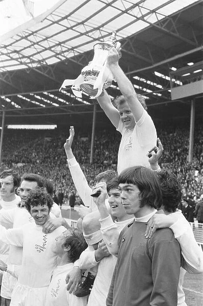 Billy Bremner Leeds United captain is lifted by his team mates with the F. A