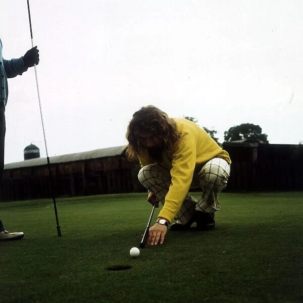 Billy Connolly 1974 golf using club as snooker cue on putting green