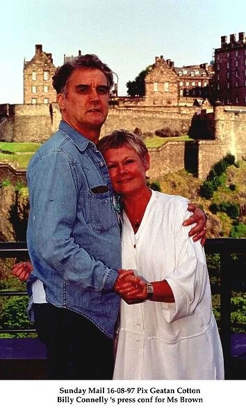 Billy Connolly with his arms around actress Judi Dench August 1997