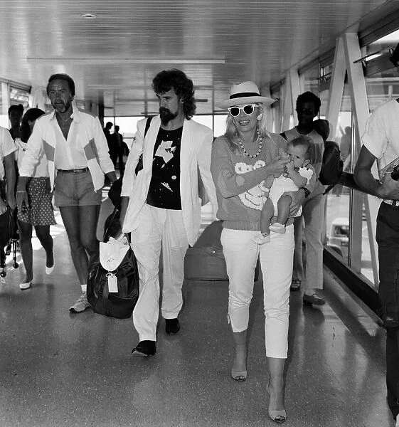 Billy Connolly and his wife Pamela Stephenson and their baby daughter Daisy arriving at