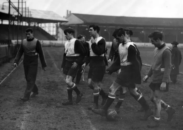 Framed Print : Billy Foulkes (left) leaves the field with some of the Babes who will probably be playing Framed Print : Billy Foulkes (left) leaves the field with some of the Babes who will probably be playing