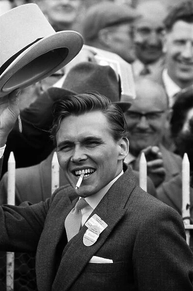 Billy Fury, on Derby Day at the Epsom Races, waving his hat to the crowds. 3rd June 1964