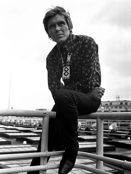 Billy Fury wearing a flowered shirt on the roof of the Daily Mirror building