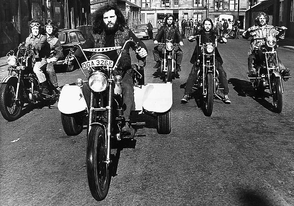 Billy Gordon rides home made tricycle in Glasgow, May 1972 Accompanied by fellow