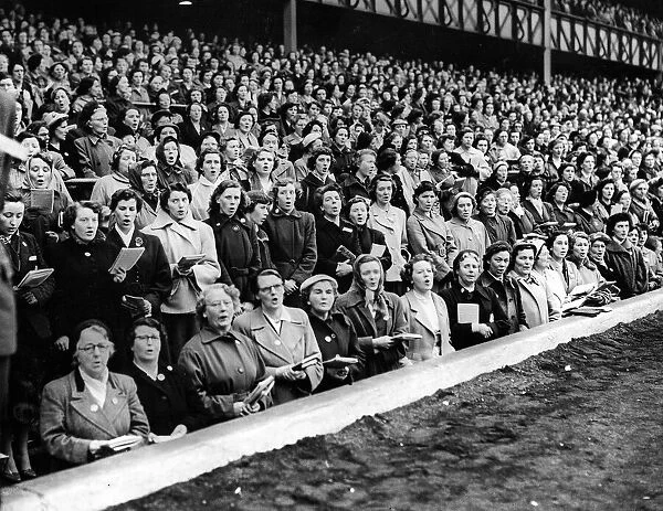 Billy Graham crusade. Crowds sing at Hampden Park in front of main South stand