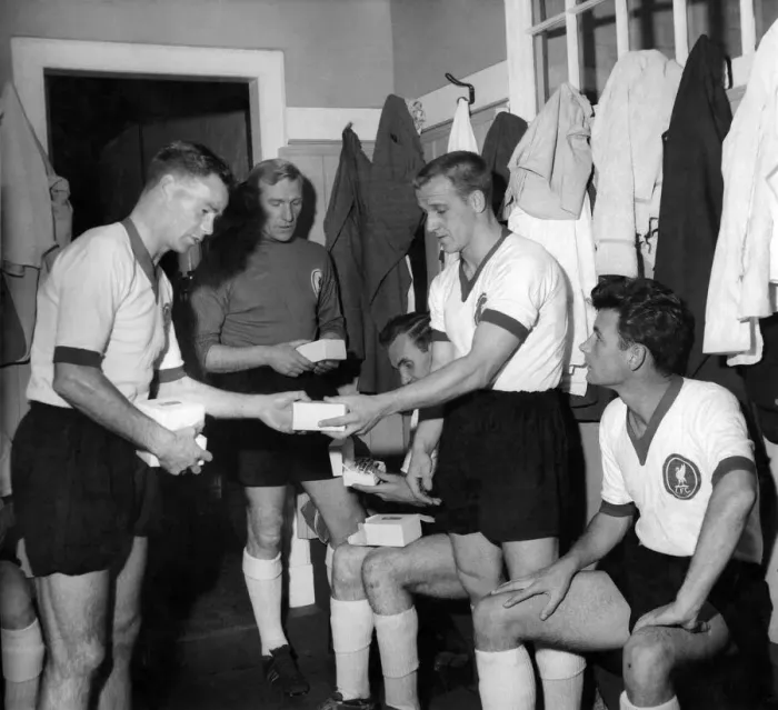 Framed Print : Billy Liddell (left) meets opposition team players in the changing room at Anfield before