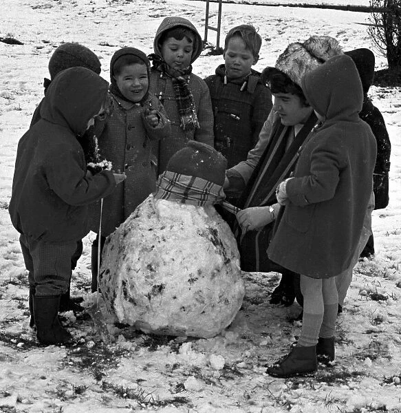 Binley Nursery school children make a snowman. Coventry. 17th January 1966