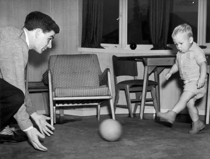 Framed Print : Birmingham City footballer Eddie Brown pictured at home in Sheldon playing with his two Framed Print : Birmingham City footballer Eddie Brown pictured at home in Sheldon playing with his two