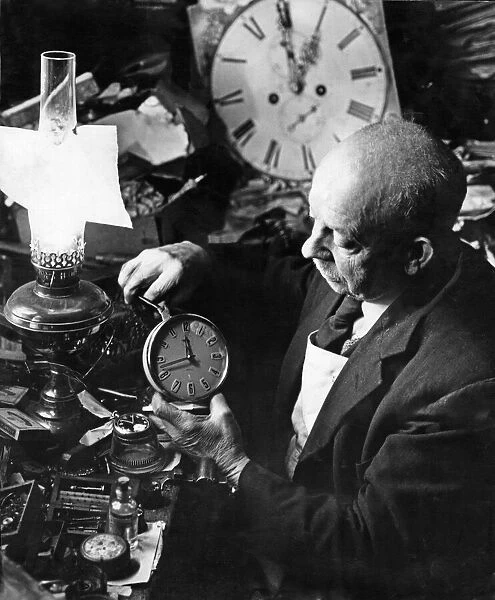 A Birmingham Clock maker seen here in his workshop. 16th April 1962