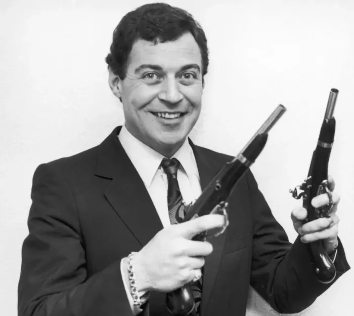 Framed Print : Birmingham Comedian, David Ismay seen posing with a gun in either hand Framed Print : Birmingham Comedian, David Ismay seen posing with a gun in either hand