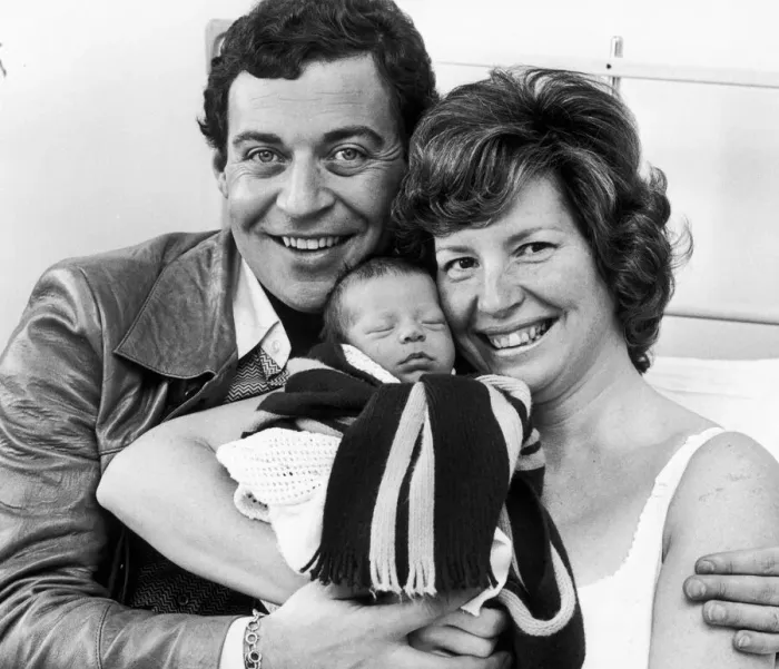 Framed Print : Birmingham Comedian, David Ismay and his wife show off their new baby