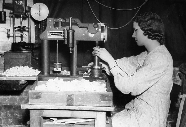 Birmingham factory worker Beatrice Payne, at work making and testing parachute hooks