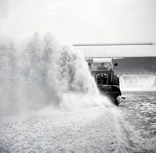 Birmingham grounds staff seen here clearing snow from the pitch at St Andrews in January
