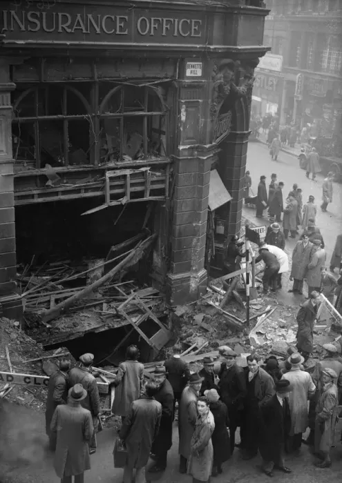 Framed Print : Birmingham residents inspect a bomb crater at the corner of Bennetts Hill and New Street
