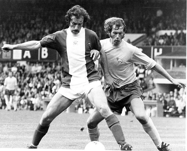 Birminghams Bob Hatton (left) tussels with Derby