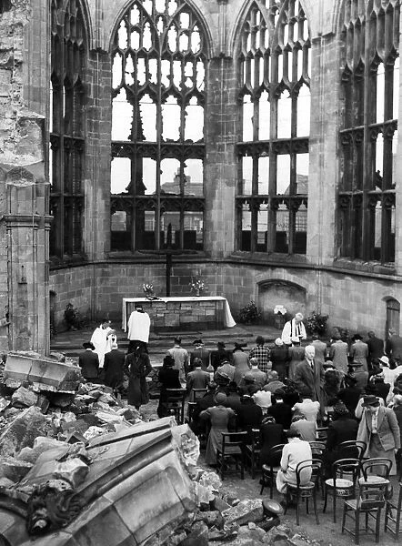 The Bishop of Coventry taking the Eight O Clock Holy Communion service in the ruins