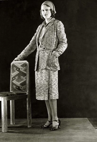 Black and Yellow flecked tweed sports suit - March 1931 The jumper is of yellow