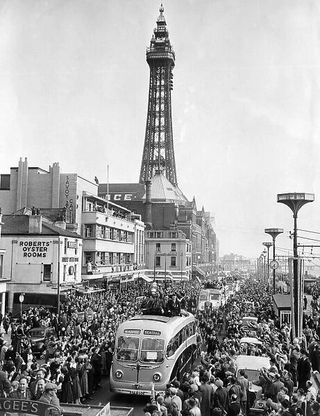 Blackpool arrive home with FA Cup. Coach passes along the promenade by the tower