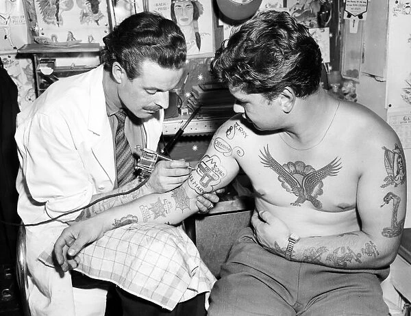 Blackpool tattooist Harry Lever tattoos a client. The new craze is for television heroes