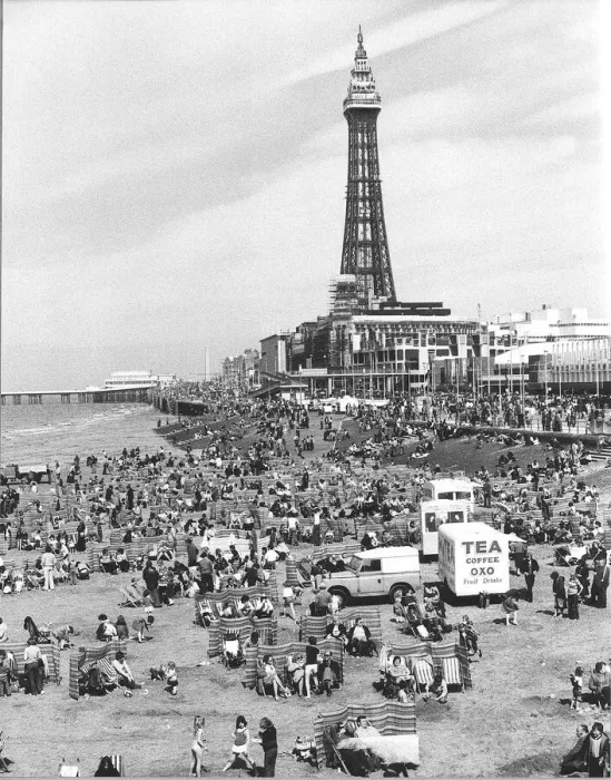 Framed Print : Blackpool Tower with people sitting on Blackpool Beach