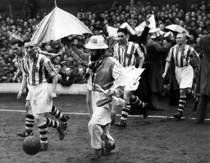 Framed Print : Blackpool v. Colchester. The Colchester team were escorted on to the field by their Framed Print : Blackpool v. Colchester. The Colchester team were escorted on to the field by their