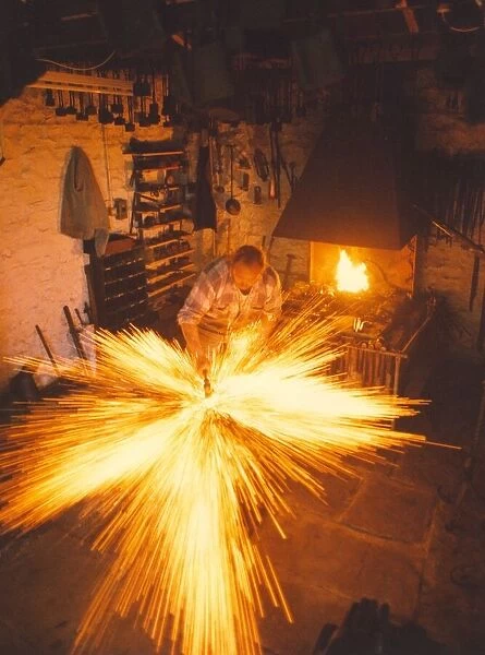 A blacksmith at work in a forge