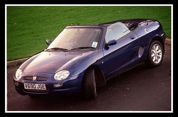 Blue MG Car November 1999 convertible hood down