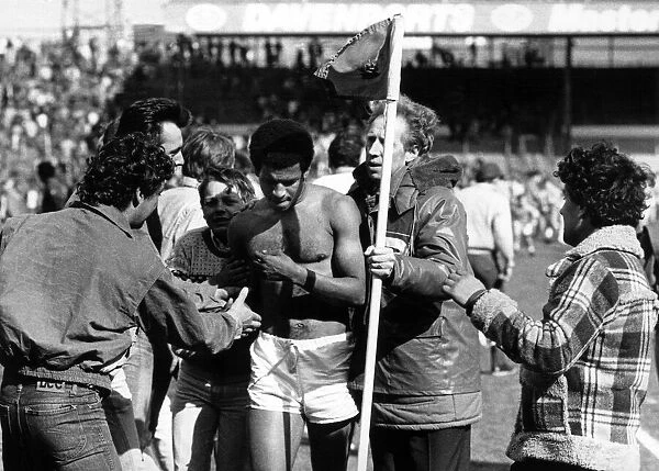Blues fans mob the shirtless Howard Gayle after the news of relegation