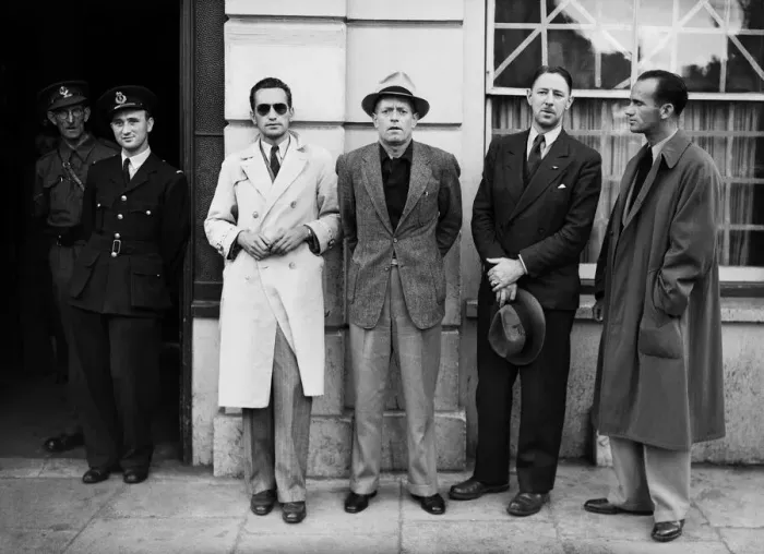 Framed Print : One of the BOAC flying boat crew poses with passengers at Poole police station where