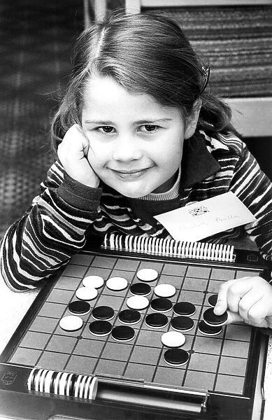 The board game Othello is childs play to four year old Elizabeth Perella in April 1977