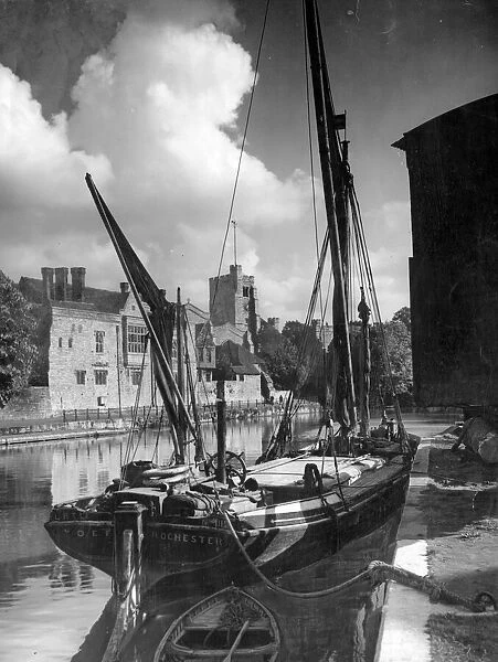 A boat in the harbour on the River Medway beneath Maidstone Church in Kent October