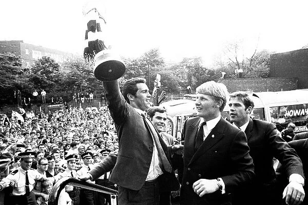Bob Moncur holds the Inter-Cities Fairs Cup aloft at St James