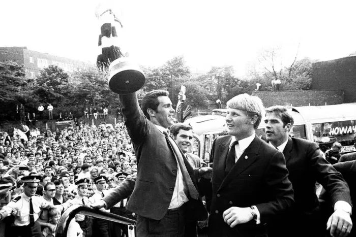 Framed Print : Bob Moncur holds the Inter-Cities Fairs Cup aloft at St James