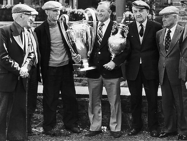 Bob Paisley former manager of Liverpool FC Football 1977 holding football trophies